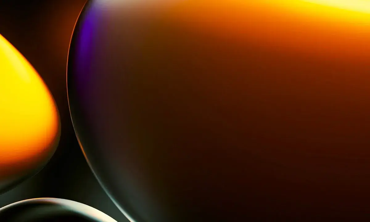 Abstract orange and purple spheres on dark background